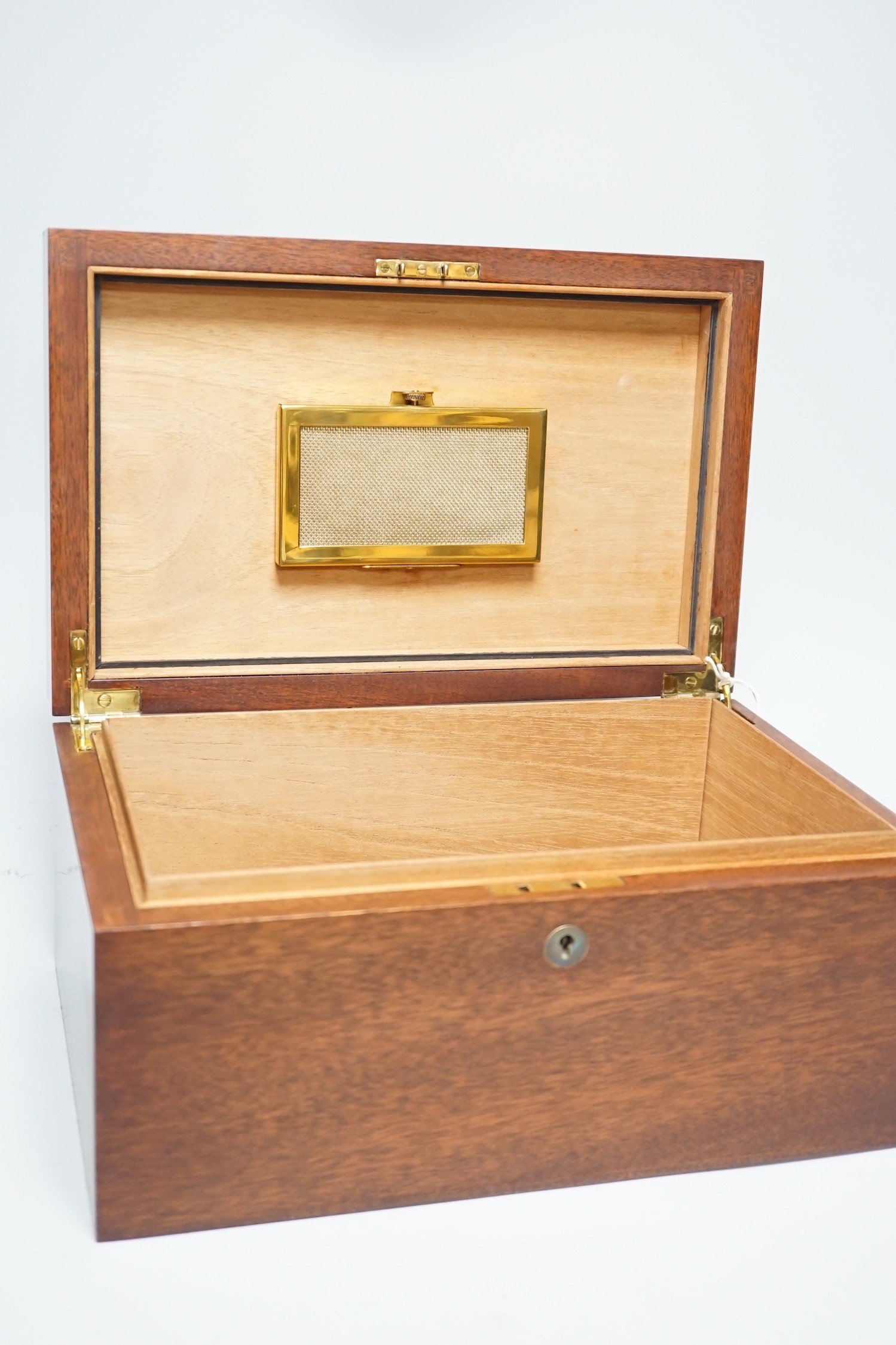 A mahogany humidor with silver cartouche inset, 33cms wide x 17cms high